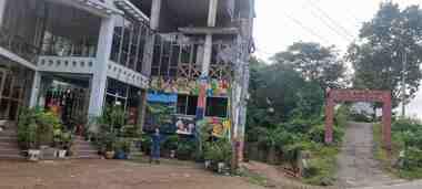 Travel Snapshot 2: Peace sign pose outside the restaurant.